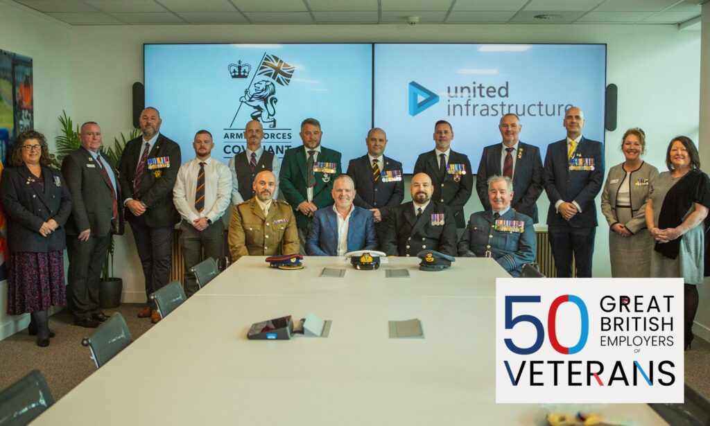 United Infrastructure employees stand together with members of the Armed Forces Covenant for a photograph