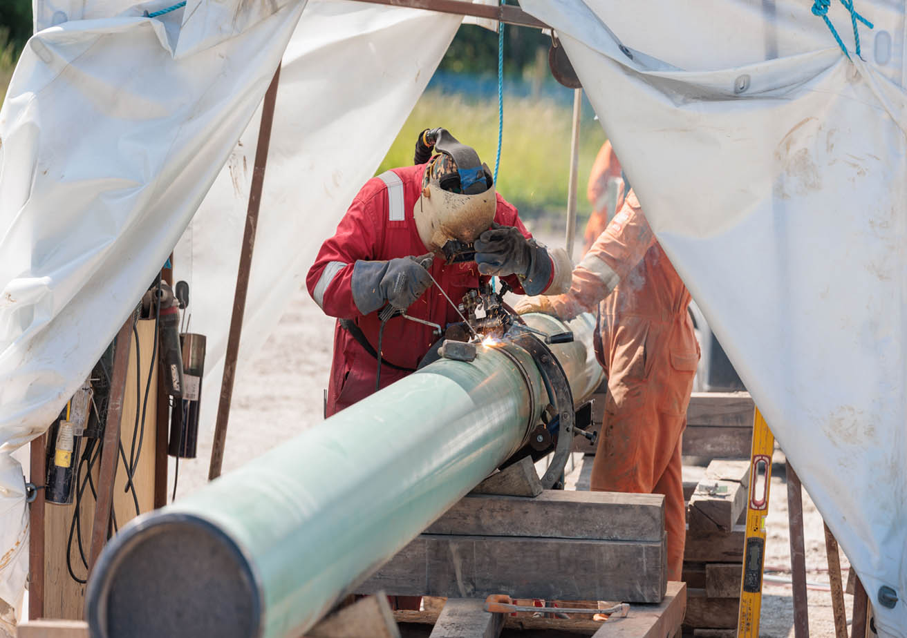 welder working on gas pipe