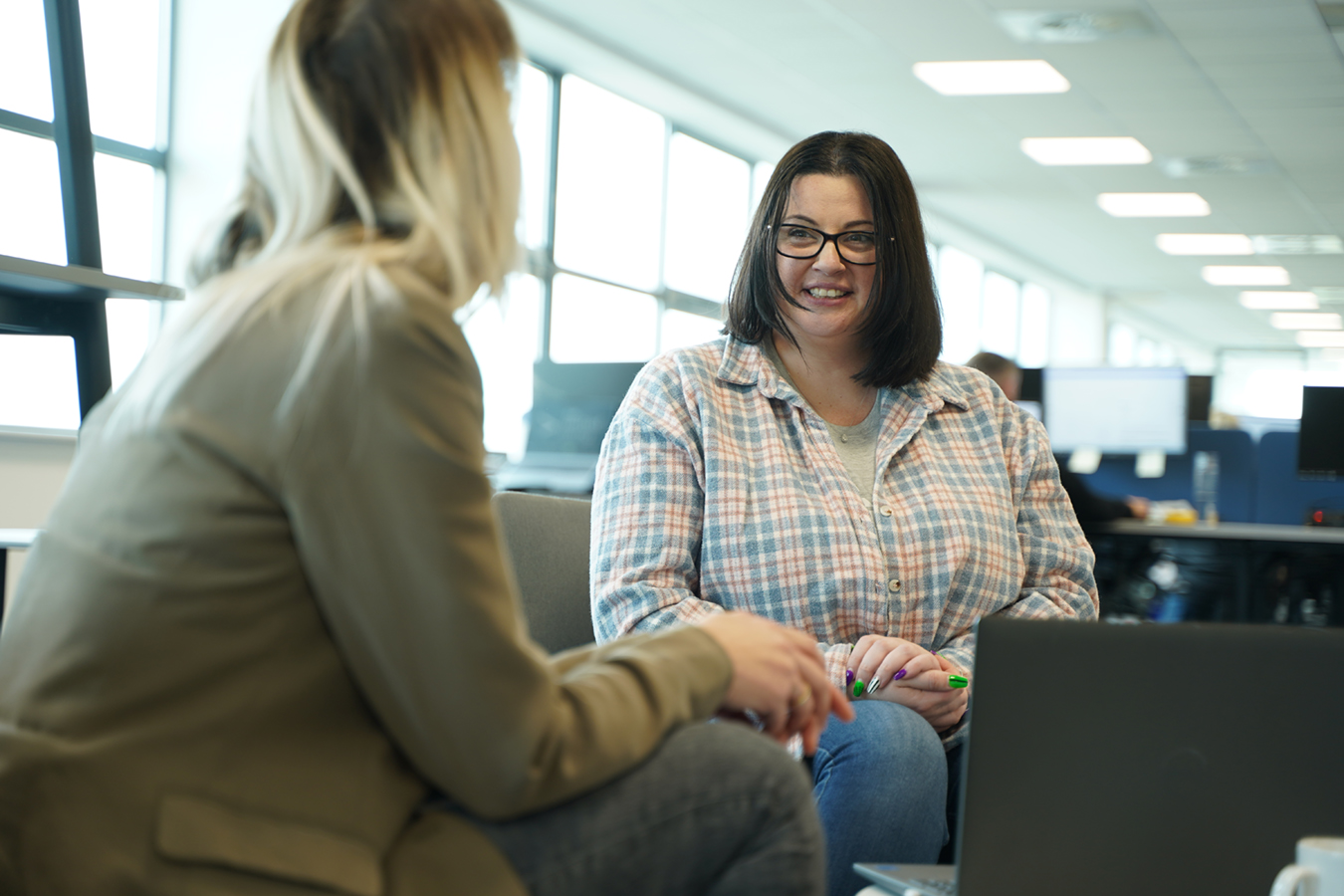 two employees chatting