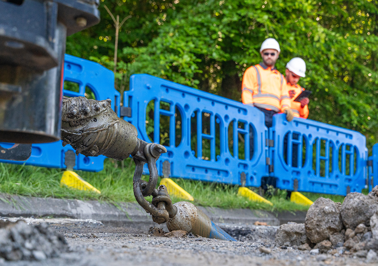construction workers digging ground up
