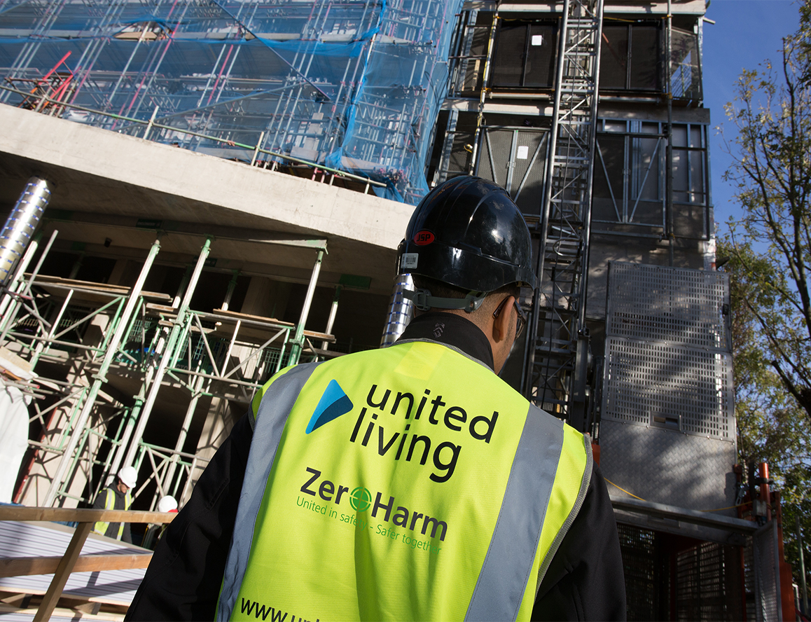 construction worker standing in front of building