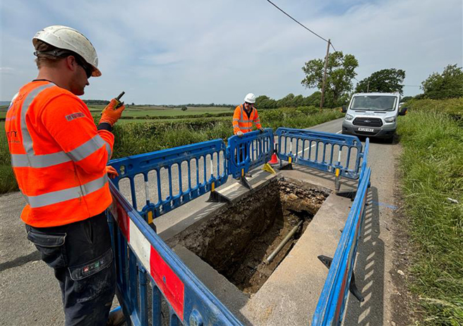 employees working over excavated ground