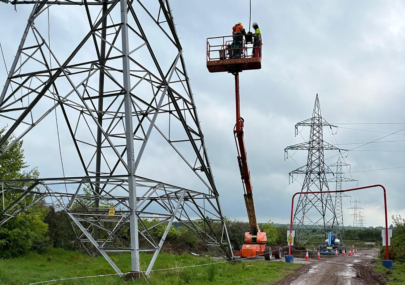 employees on site with forklift at power station