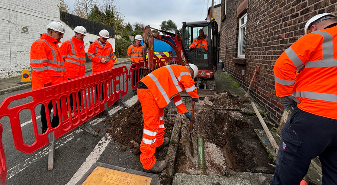 employees working on excavated ground for fixed line installation