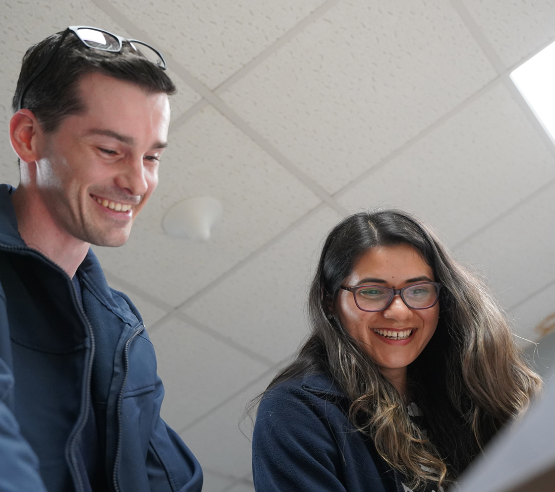 employees reading over notes together