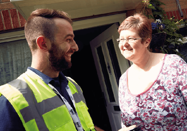 property services employee standing with resident