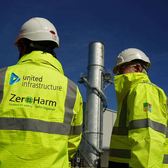 united infrastructure employees wearing high visibility jackets and hard hats