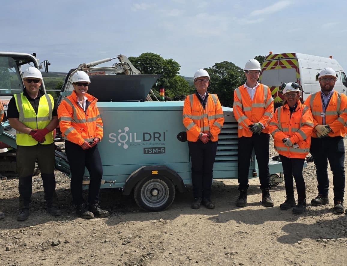 The United Infrastructure and SoilDri teams pictured alongside the TSM-5 soil mixing machine following the launch of a national partnership. Dan Macey, Director of Strategic Growth at SoilDri, is pictured third left, with Kelly Macfarlane, Managing Director of United Infrastructure Water, fourth left.